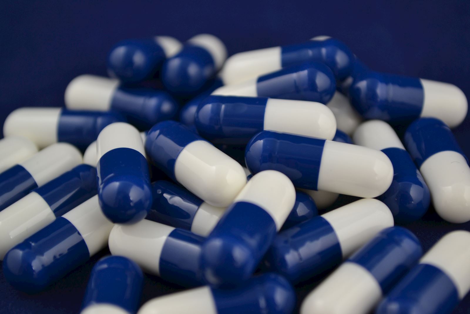 Blue and white pharmaceutical capsules