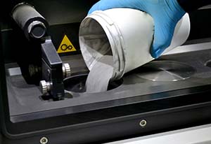 Image of metal pouring into laser sintering machine