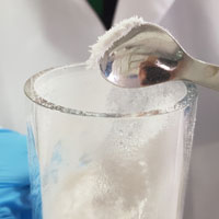 Powder stuck to a metal spoon by static