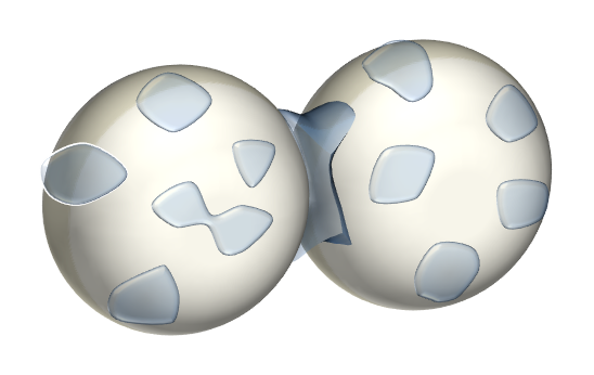 Two particles with water droplets on surface showing liquid bridging.